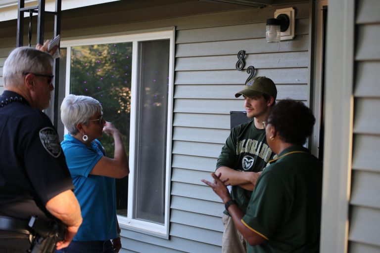 A group chatting with a neighbor during Community Welcome
